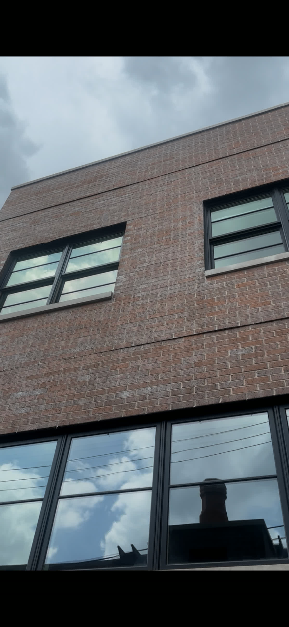 Crystal-clear windows on a modern brick building